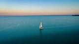 aerial view of sailboat at sunset