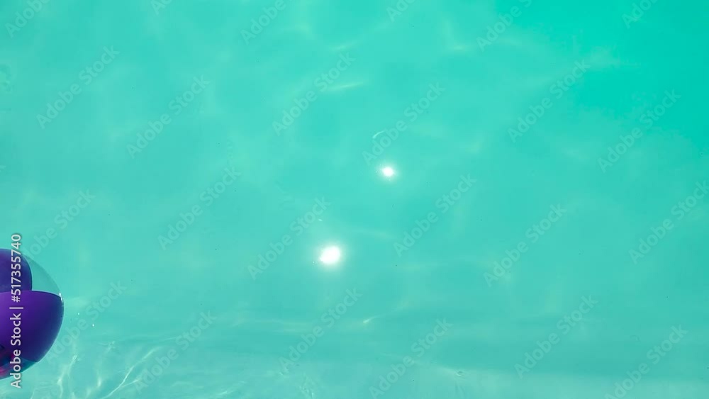 inflatable beach ball filled with feathers floating in motion on the ...