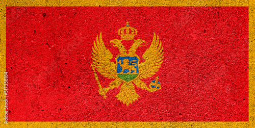 State flag of Montenegro on a plaster wall