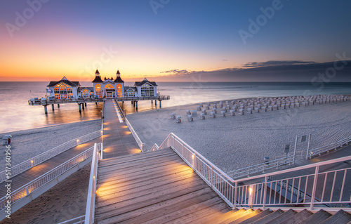 Fototapeta Naklejka Na Ścianę i Meble -  Famous Sellin Seebruecke Sellin Pier in beautiful golden morning light at sunrise in summer, Ostseebad Sellin tourist resort, Baltic Sea, Germany