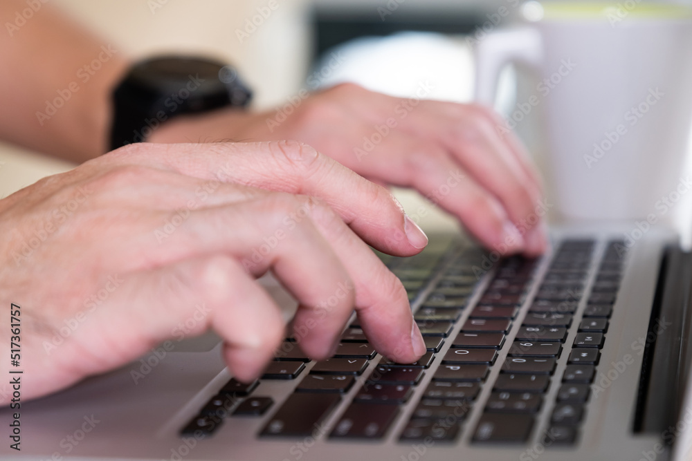 Men hand typing on computer keyboard while working from home or using internet for online shopping and social network. Laptop device and Wireless technology concept. Men hand typing on computer keyboard while working from home or using internet for online shopping and social network. Laptop device and Wireless technology concept.