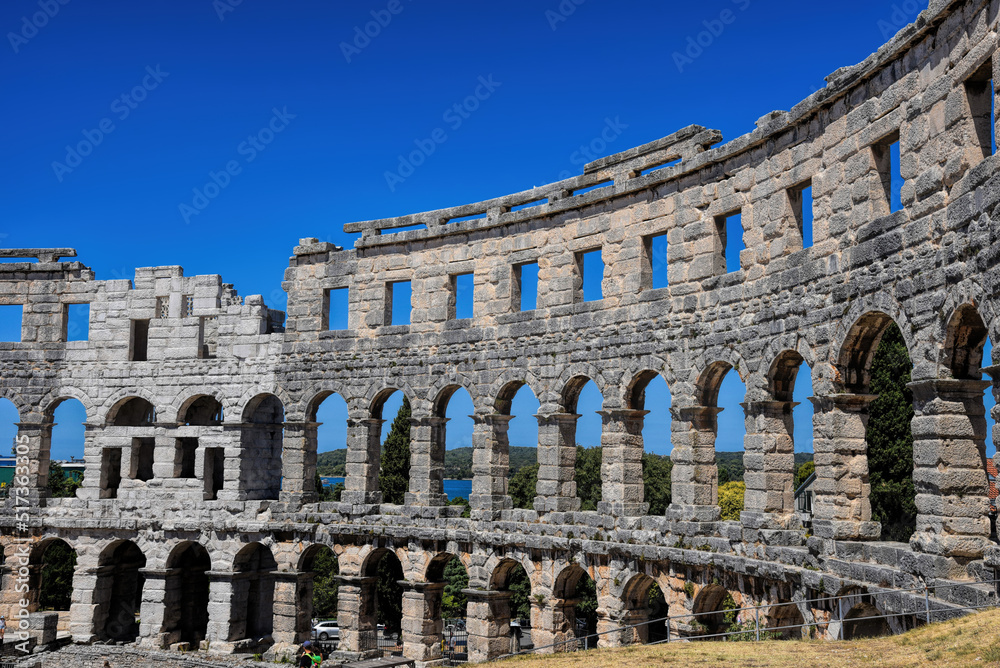 Pula, Croatia - 07 07 2022: Photography of ancient walls and architectural detail of arena in Pula from Roman period.