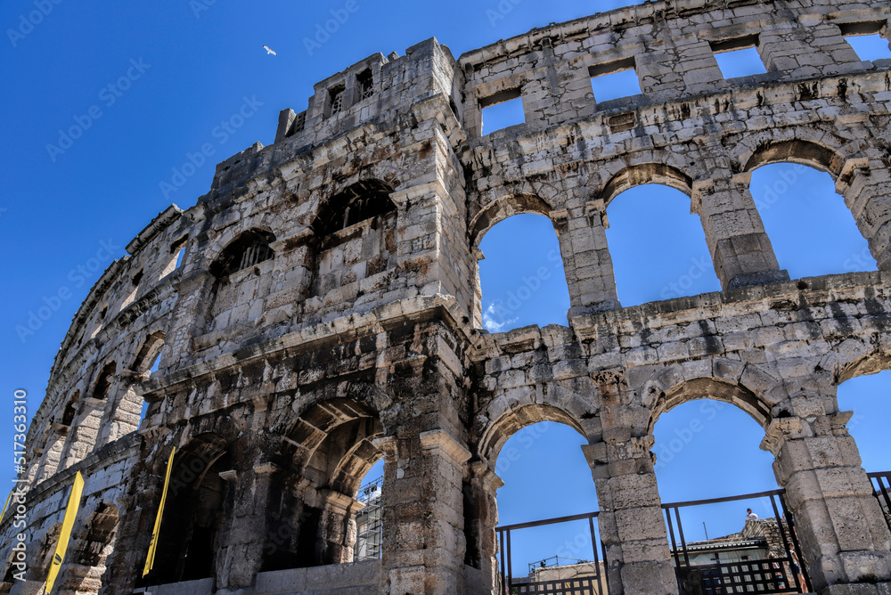 Pula, Croatia - 07 07 2022: Photography of ancient walls and architectural detail of arena in Pula from Roman period.
