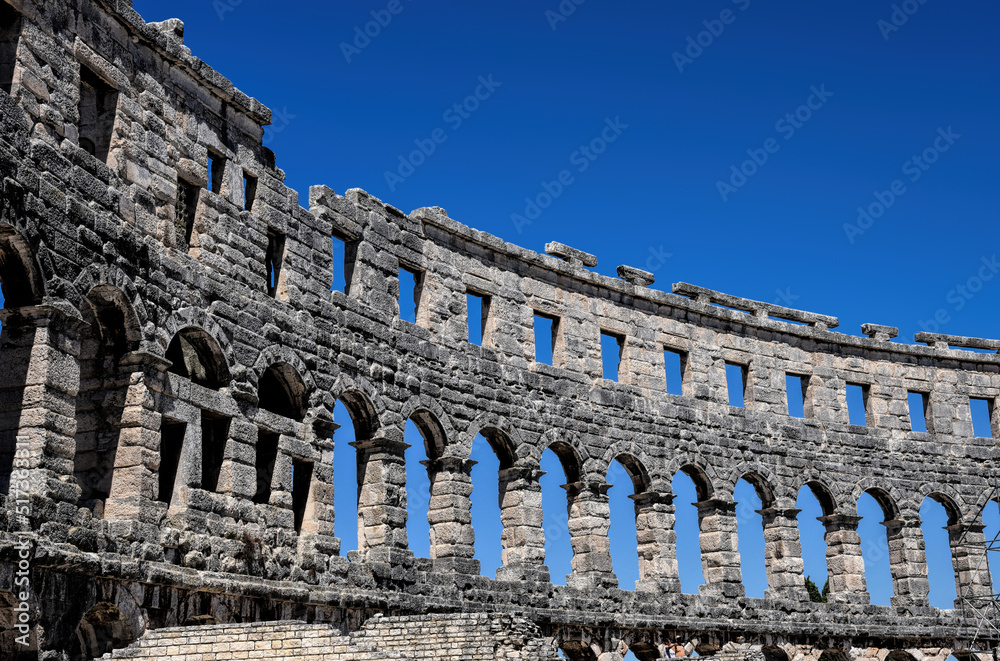 Pula, Croatia - 07 07 2022: Photography of ancient walls and architectural detail of arena in Pula from Roman period.