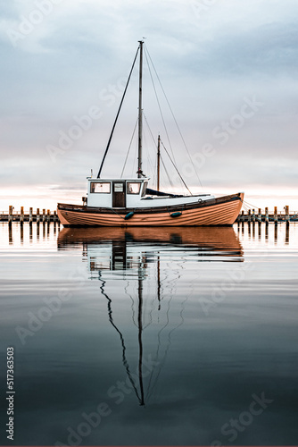 Small Boat Reflection in Harbor