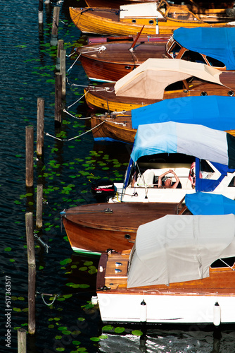 Man Sleeping on Small Boat in Sunlight