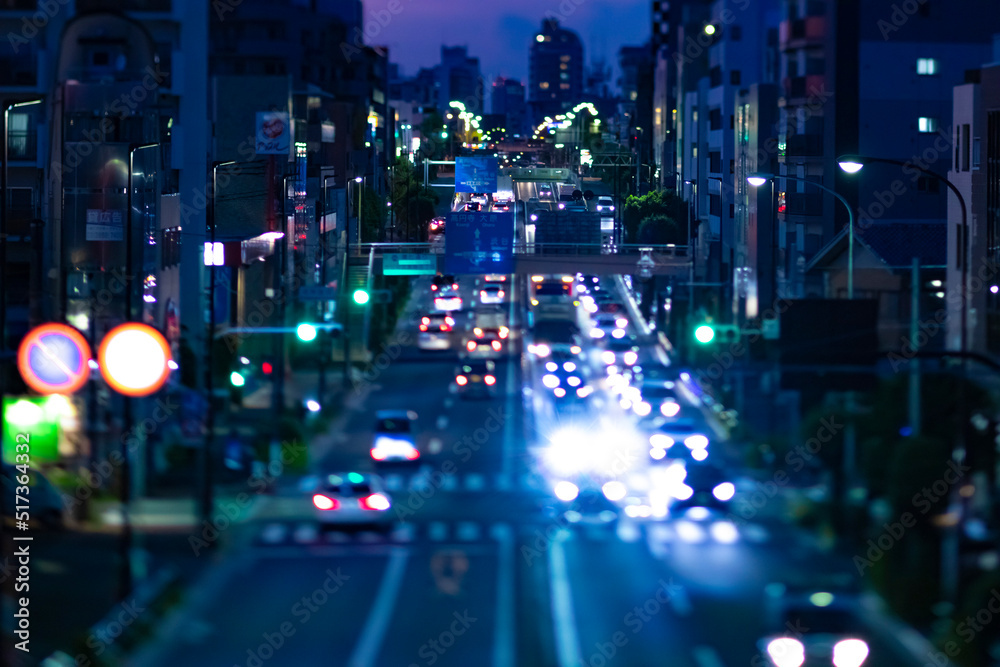 A miniature traffic jam at the street in Setagaya Tokyo at dusk.