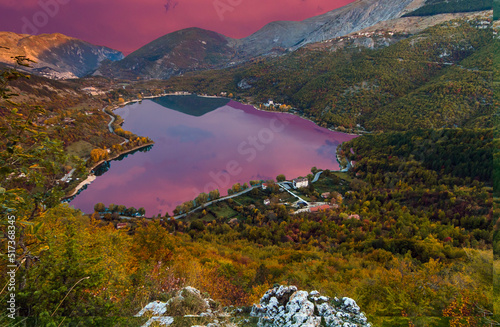 Stunning view of the heart-shaped Scanno lake at sunrise, the most famous and romantic lake in Abruzzo national Park, central Italy photo