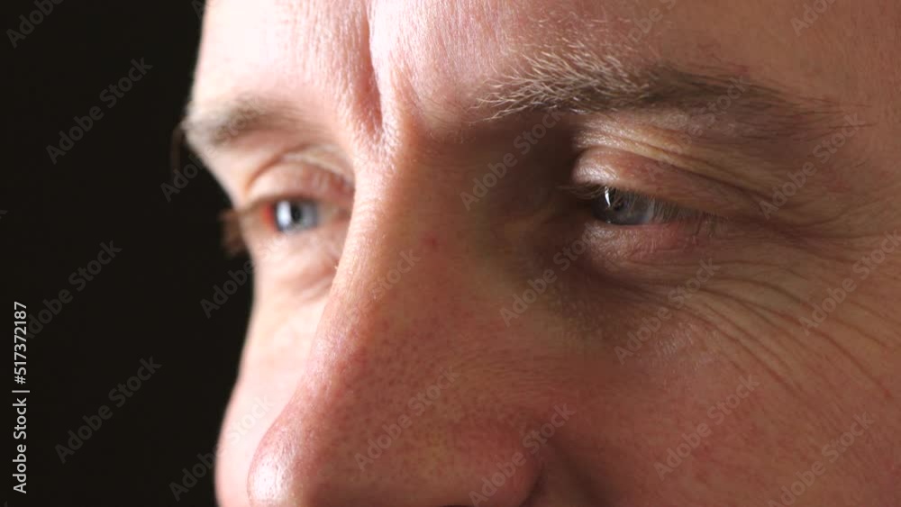 Closeup eyes of a man staring and blinking while looking focused, thinking of ideas. Man with blurry vision trying to see clearly and feel awake. Blue eyed man doing test during optometry appointment Closeup eyes of a man staring and blinking while looking focused, thinking of ideas. Man with blurry vision trying to see clearly and feel awake. Blue eyed man doing test during optometry appointment