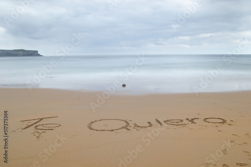 I love you written on the sand of the beach