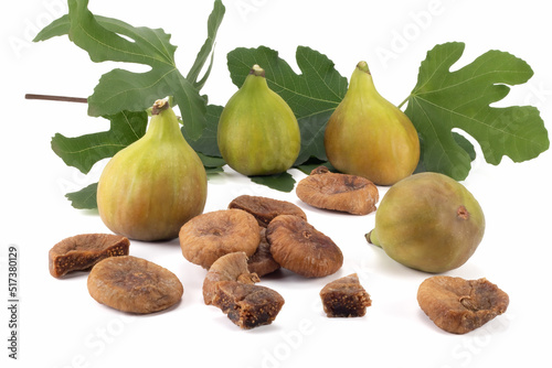 Fresh and dry figs with leaves isolated on bright background. Close up view.