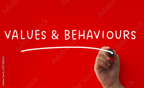 Values and behaviour text on red cover background. Conceptual