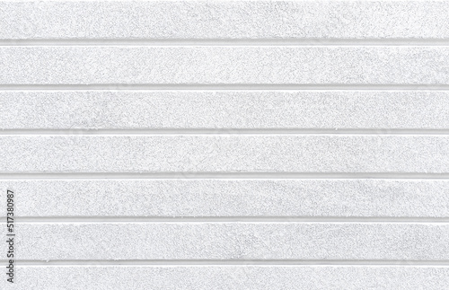 White cement wall texture with horizontal panels. House exterior walls design.