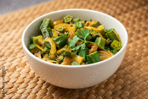 Bhindi do pyaza is a restaurant style North Indian dish made with okra or ladies finger or ochro, spices, herbs & lots of onions photo