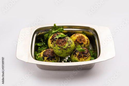 Indian style Tinda or Tinde ki Sabzi also called Indian squash, round melon, Indian round gourd or Indian baby pumpkin, stuffed, stir fried dry or curry recipe photo