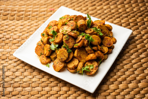 Stir fried taro roots. Arbi ki sabji, ghuiya masala curry Sabzi or arvi dum Masala. Garnished with coriander photo