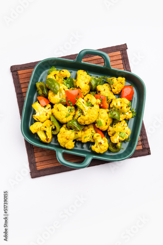 Indian phool Gobi Shimla Mirch Sabji Recipe or Capsicum Cauliflower Sabzi  - a healthy and homemade dry vegetable dish.  photo