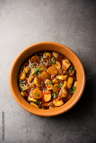 Stir fried taro roots. Arbi ki sabji, ghuiya masala curry Sabzi or arvi dum Masala. Garnished with coriander photo