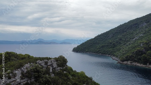 Adriatic sea flow between green hills