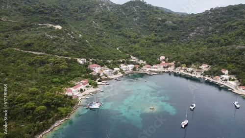 Flying up Okuklje bay with anchored yachts photo