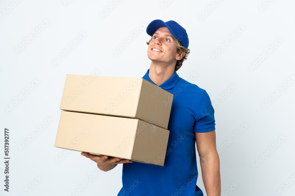 Delivery man over isolated white background thinking an idea while looking up Delivery man over isolated white background thinking an idea while looking up