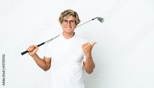 English man playing golf pointing to the side to present a product