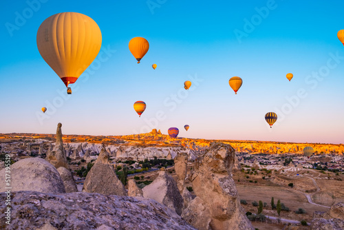 Amazing view of Cappadocia, Turkey. Colorful hot air balloons flying over valley landscape