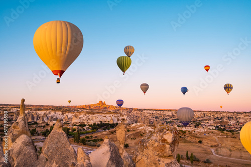 Hot air balloons making bright sky in Cappadocia, Turkey