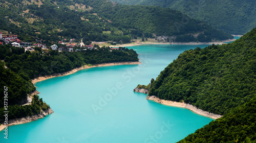 Scenic view on canyon lake Piva with mountains in Montenegro. Beautiful aerial drone shot of nature in national park