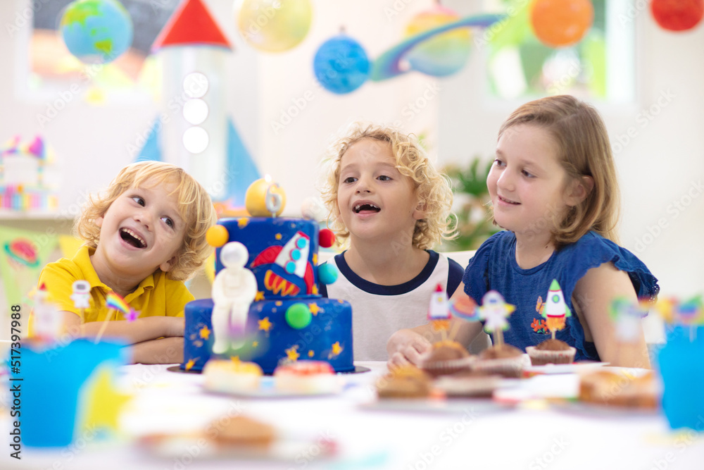 Fototapeta premium Kids space theme birthday party with cake.