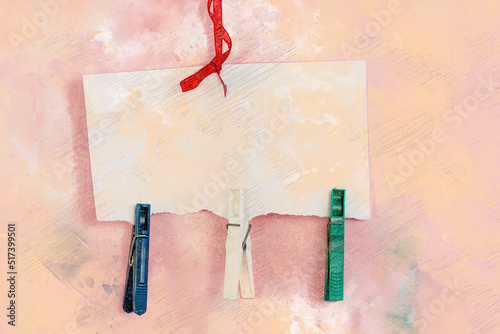 Sewing tape three plastic clothespins and white piece of paper against  pink background. Clothespins hang vertically on the torn blank sheet. Digital watercolor painting. Canvas texture