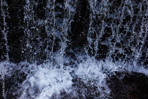 Waterfall with flowing water closeup