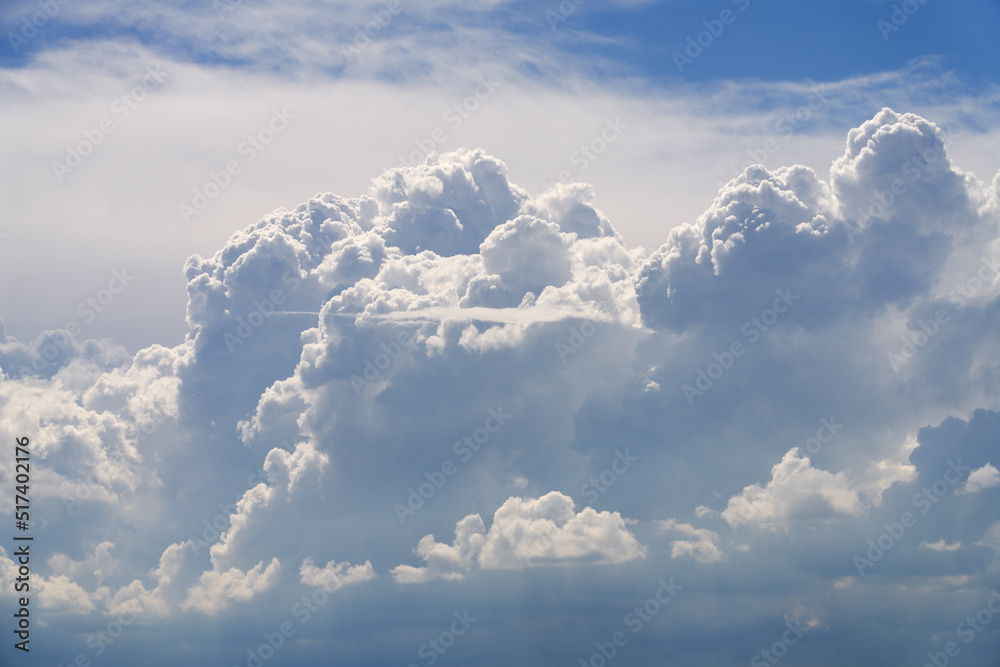 A beautiful cluster of voluminous cumulus forms in the sky before the rain. Natural background. Shooting from a drone. Copy space. A beautiful cluster of voluminous cumulus forms in the sky before the rain. Natural background. Shooting from a drone. Copy space.