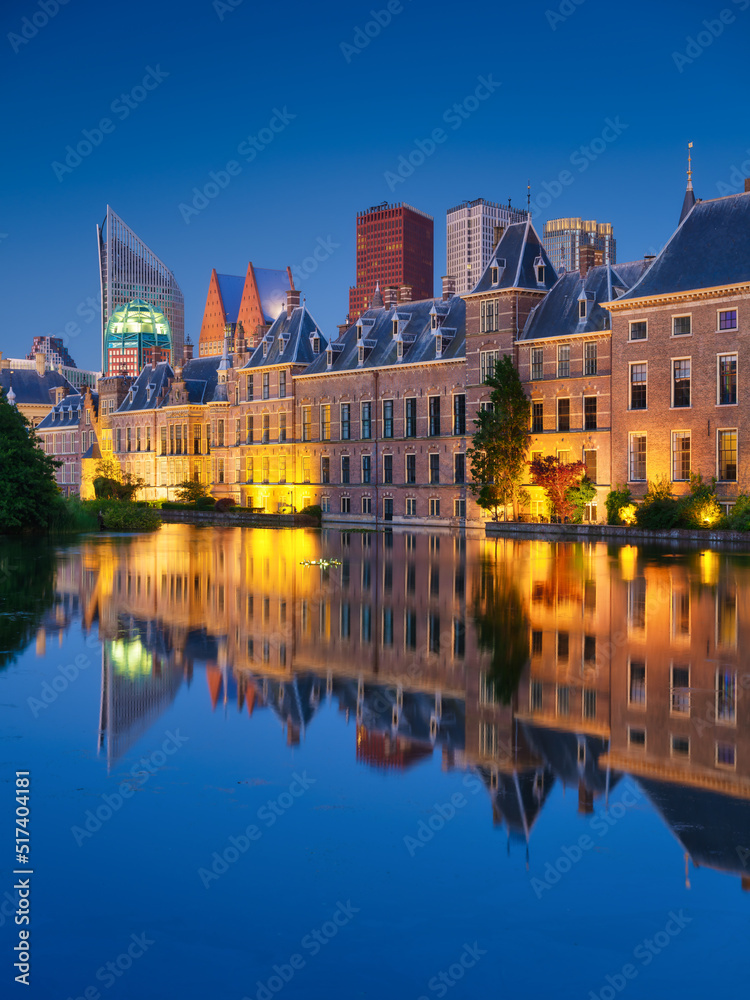 Fototapeta premium The Hague, Netherlands. A cityscape in the evening. View of historical buildings and modern business center. Reflections in the water. Architecture and design in the Netherlands.