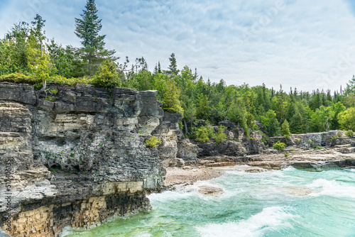 Colourful green waters at Indian Head Cove on lake Huron in Bruce Peninsula National Park and clear blue water in Ontario  Canada. Located between The Grotto and Overhanging rock tourist attractions.