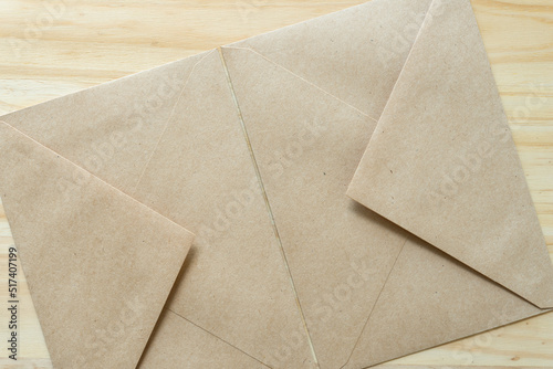 two brown paper envelopes touching