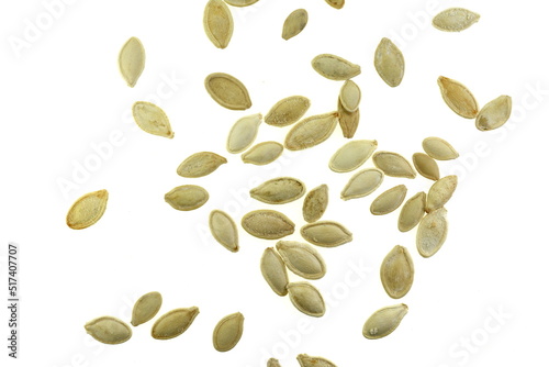 Heap of pumpkin seeds isolated on white background