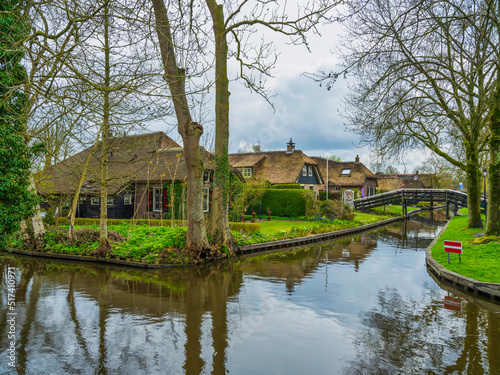 Thatched roof houses on Canal side in the fairy tale village of Giethoorn, Netherlands