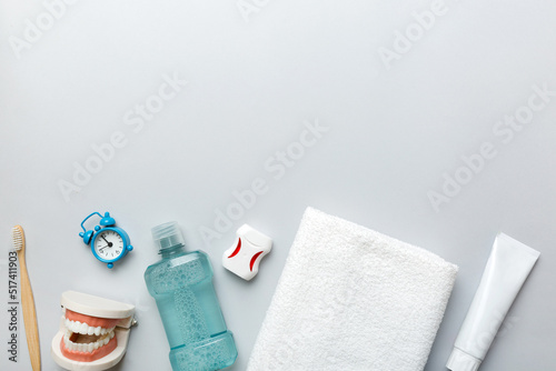 Mouthwash and other oral hygiene products on colored table top view with copy space. Flat lay. Dental hygiene. Oral care products and space for text on light background. concept
