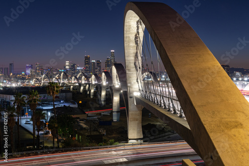 New 6th Street bridge in Los Angeles at sunset with the Los Angles skyline in the distance
