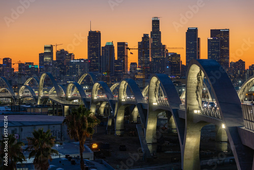 New 6th Street bridge in Los Angeles at sunset with the Los Angles skyline in the distance