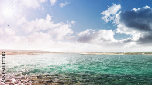 Fototapeta Naklejka Na Ścianę i Meble -  Island. Turquoise sea water, ocean wave, sunny blue sky, white clouds, beautiful seascape, summer vacation, exotic island vacation. Nature background