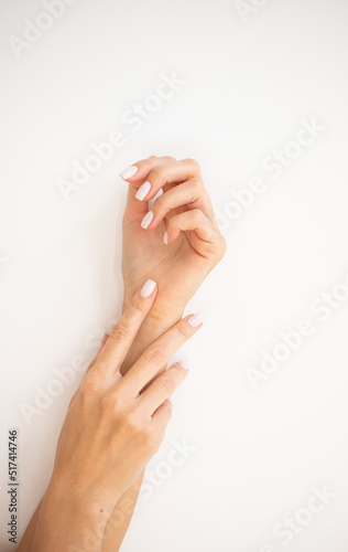 woman applying cream on their hands