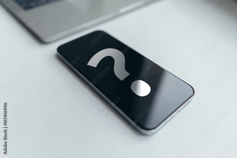 Question mark concept or FAQ. phone on the table Question mark concept or FAQ. phone on the table