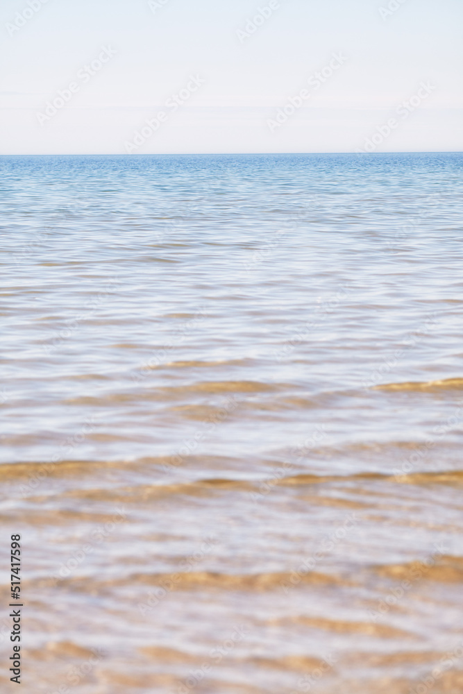 Copy space at the sea with a clear blue sky background above the horizon. Calm ocean waters at an empty beach. Peaceful and scenic coastal landscape for a relaxing and zen summer getaway in nature Copy space at the sea with a clear blue sky background above the horizon. Calm ocean waters at an empty beach. Peaceful and scenic coastal landscape for a relaxing and zen summer getaway in nature