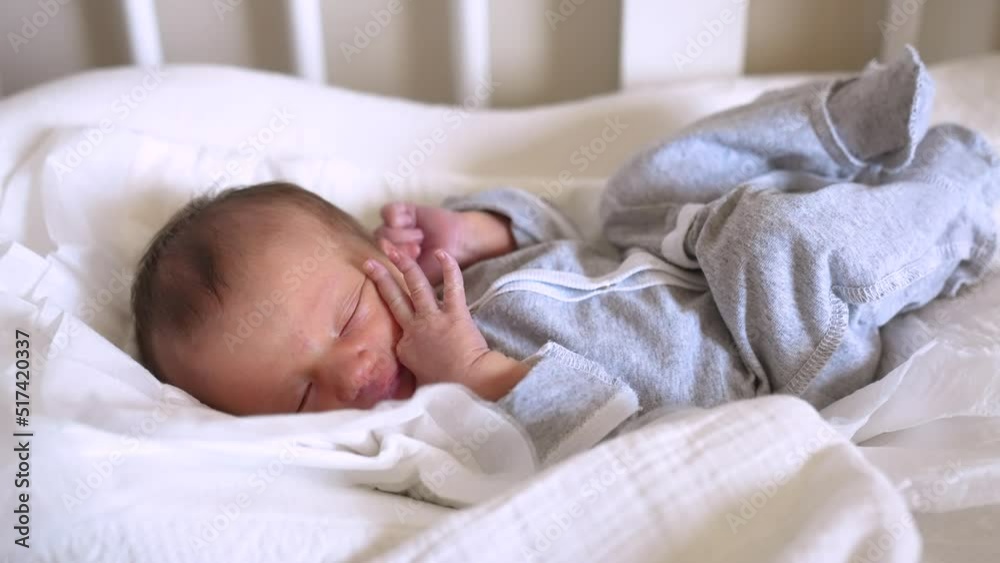 newborn baby sleeping. cute a brunette newborn baby sleeping in bed close up in maternity hospital bedroom. happy family kid dream concept. cute newborn baby girl lifestyle sleeping close up newborn baby sleeping. cute a brunette newborn baby sleeping in bed close up in maternity hospital bedroom. happy family kid dream concept. cute newborn baby girl lifestyle sleeping close up