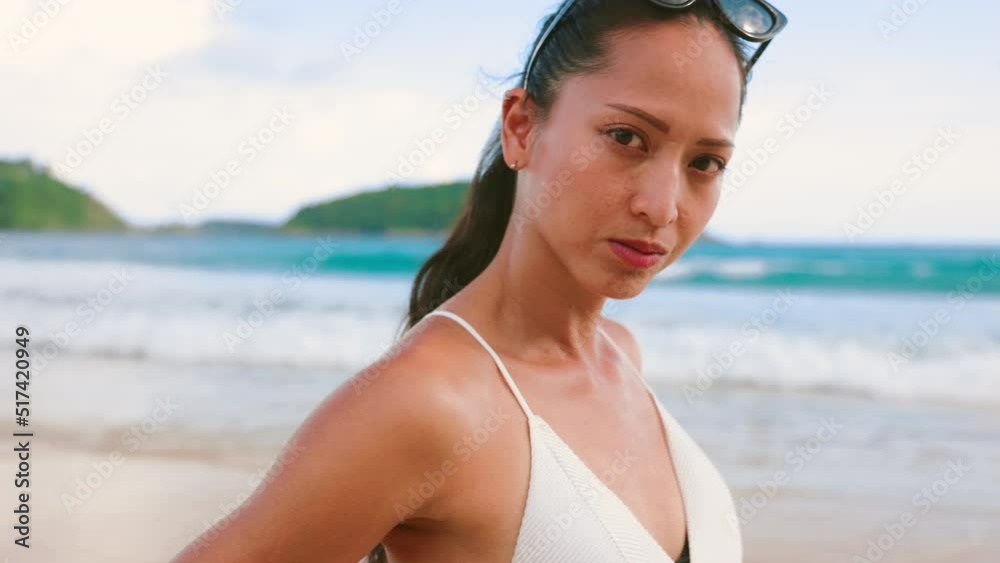 Portrait of a sport fashion Asian woman tan skin in black bikini Portrait of a sport fashion Asian woman tan skin in black bikini
