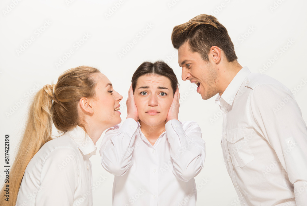 team of young business people in white shirts on a white background isolated. a team of two girls and a guy is happy, wins, plans, argues, discusses, gets upset, wins something. close-up portrait team of young business people in white shirts on a white background isolated. a team of two girls and a guy is happy, wins, plans, argues, discusses, gets upset, wins something. close-up portrait
