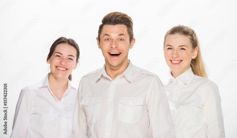 team of young business people in white shirts on a white background isolated. a team of two girls and a guy is happy, wins, plans, argues, discusses, gets upset, wins something. close-up portrait team of young business people in white shirts on a white background isolated. a team of two girls and a guy is happy, wins, plans, argues, discusses, gets upset, wins something. close-up portrait