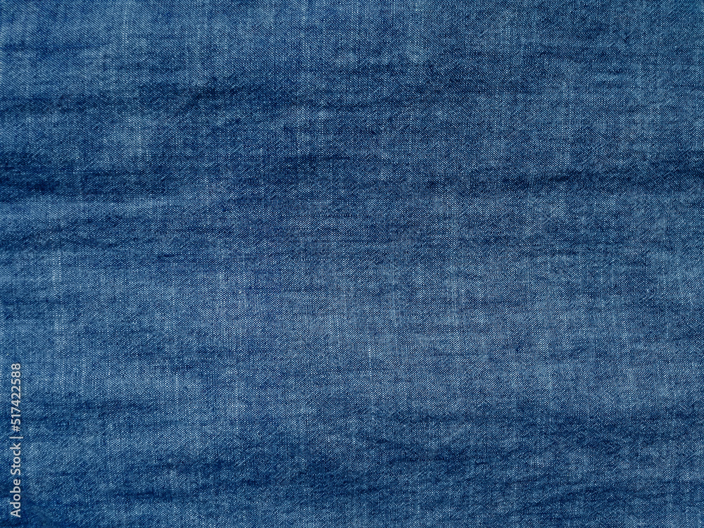 blue jeans or cloth with wave pattern texture. blue jeans or cloth with wave pattern texture.